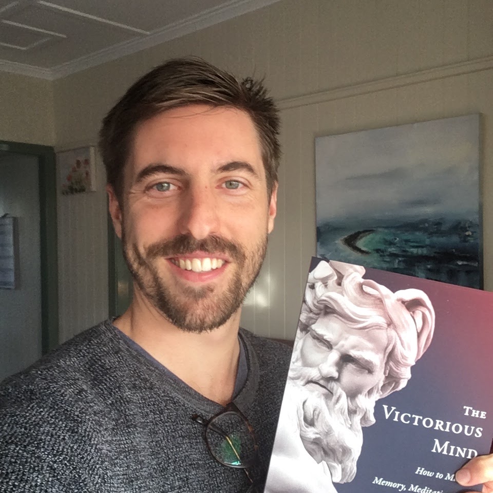 Sam Ross with a copy The Victorious Mind by Anthony Metivier